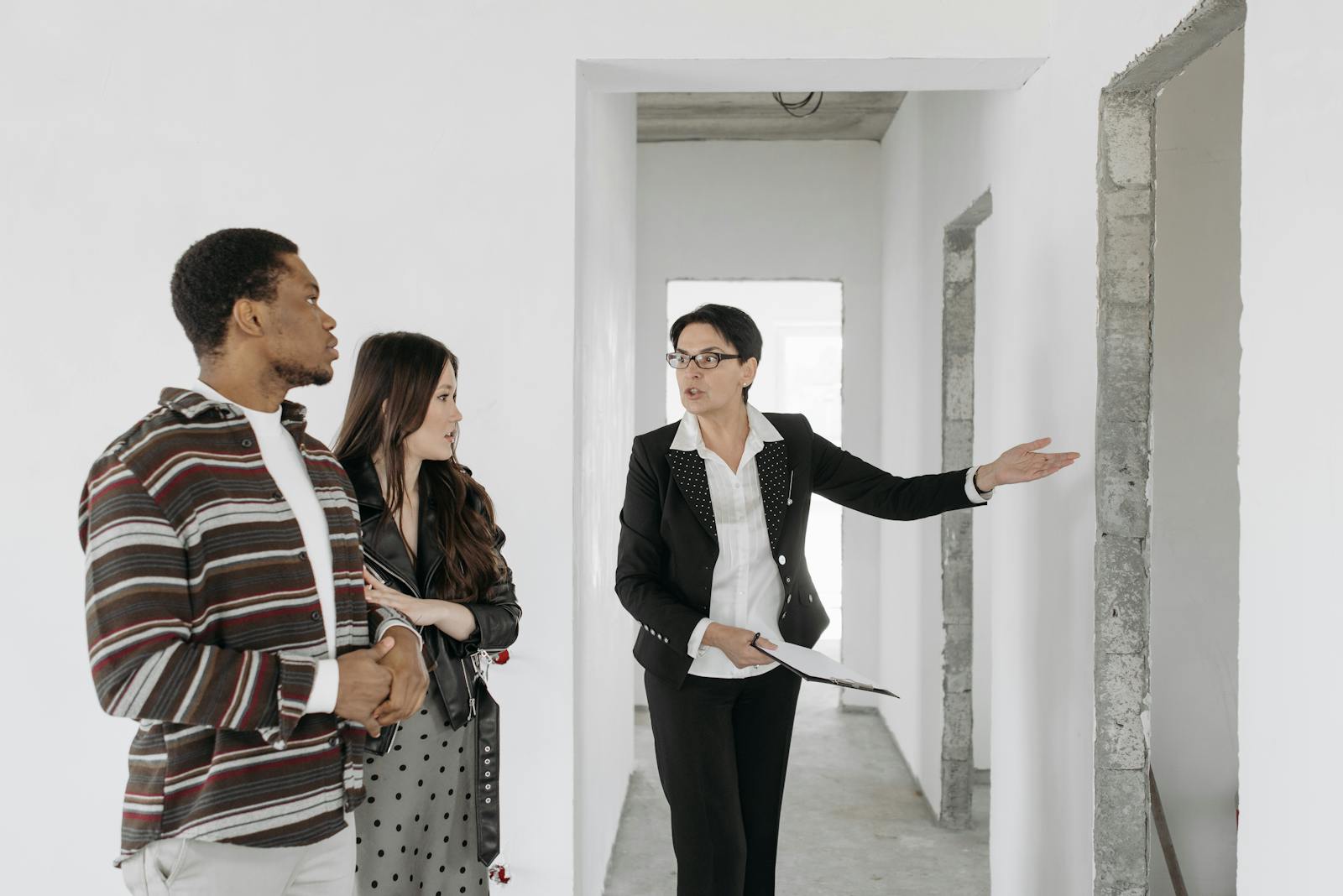 Real Estate Agent Showing Apartment to Couple